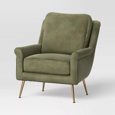 an olive green chair with gold legs