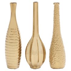 three gold vases sitting next to each other