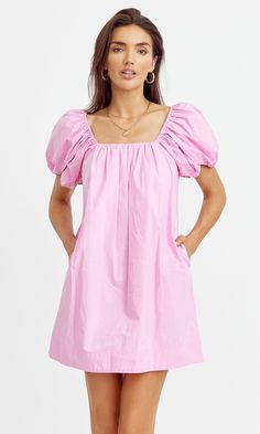 Poplin mini dress with dramatic puff sleeves and flattering square neckline. The shift dress features hidden pockets for convenience. Midi dress Bubblegum pink Pockets Self: 70% Viscose 30% Nylon Lining: 100% Polyester Length: 33 1/2" Chest: 17 3/4" Self: 100% Cotton Lining: 100% Cotton Hand wash cold water with similar colors. Hang dry. Low iron, or dry clean Model is wearing a size small Style #: G242D5752 Cruise Fits, Adorable Dresses, Recruitment Outfits, Beach Fits, Tulip Sleeve, Midi Shift Dress, School Events, Grad Dresses, Luxury Women Fashion