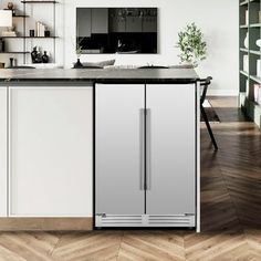 a modern kitchen with stainless steel appliances and wood flooring