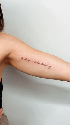 a woman with a tattoo on her arm that says, happy valentine's day