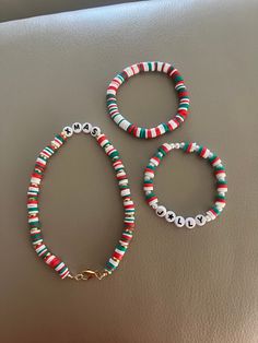 three bracelets are sitting on a table