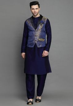 Art Silk Kurta in Navy BlueThis Readymade attire is Enhanced with Buttons. Crafted in Chinese Collar Neck and Full SleeveAvailable with an Art Silk Pant in Navy Blue and an Art Brocade Silk Nehru Jacket in Navy BlueDo note: Brooch and Footwear shown in the image is for presentation purposes only. Half to one inch may vary in measurement. (Slight variation in actual color vs. image is possible) We sell all kinds of menswear. Mens Kurta | Mens Kurta Pajama | Mens Sherwani | Mens Sherwani Sets | Tr Traditional Blue Sets For Winter, Traditional Blue Winter Sets, Fitted Blue Outerwear For Festive Season, Royal Blue Winter Outerwear, Festive Blue Long Sleeve Outerwear, Blue Nehru Jacket With Long Sleeves For Winter, Blue Long Sleeve Nehru Jacket For Winter, Festive Blue Nehru Jacket With Long Sleeves, Blue Long Sleeve Outerwear For Festive Occasions