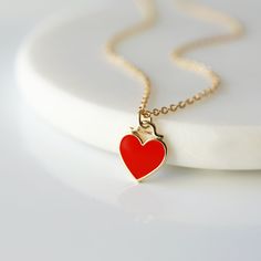 "Beautiful and lovely red heart charm necklace. Made of red enamel gold heart charm with skinny gold plated brass chain. Simple and warm. Great for gift, everyday or special occasion. Please choose chain color and length. Your item will ship in a gift box. Please feel free to contact me if you have any questions. ♥ Chain length available 14\" - 20\" ♥ Red heart 3/8\" ♥ Gold plated over brass/enamel ♥ See more Rudiana Accessories Rudiana.etsy.com" Enamel Heart Charm Necklace For Valentine's Day, Red Enamel Charm Necklaces For Gifts, Gold Enamel Heart Necklace For Valentine's Day, Red Heart Pendant Necklace For Everyday, Dainty Red Charm Necklace For Everyday, Valentine's Day Gold Enamel Heart Necklace, Valentine's Day Gift Enamel Charm Necklaces, Valentine's Day Gift Enamel Charm Necklace, Red Enamel Heart Pendant Necklace