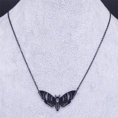 Add some flutter with this moth pendant! Perfect for the fashion-forward individual who isn't afraid to stand out. Available in black, and silver stainless steel options - because every moth has a unique style. Necklace Material: Stainless Steel Length: 19.7 inches Gothic Moth, Moth Pendant, Fade Color, Stainless Steel Pendant, Style Necklace, Black And Silver, Stainless Steel Necklace, Engagement Gifts, Shape Patterns