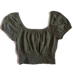 Olive Green Eyelet Crop Top Size Small New With Tags! Measurements Are Approximate And Taken Flat Bust: 15” Sleeve: 8” Length: 10.5” Waist: 11-14” Summer Peasant Top With Smocked Cuffs, Casual Green Smocked Top With Puff Sleeves, Casual Stretch Crop Top With Smocked Back, Casual Cropped Cotton Smocked Top, Casual Cotton Crop Top With Smocked Back, Spring Casual Peasant Top With Elastic Neckline, Summer Peasant Blouse With Smocked Bodice, Casual Cotton Peasant Top With Smock Detail, Casual Cotton Smock Peasant Top