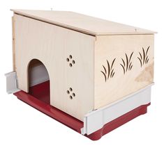 a wooden dog house with red carpet and white trim