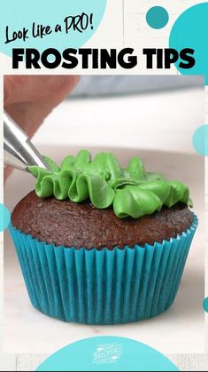 a cupcake with green frosting is being cut