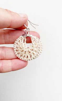 Crochet cream hoop earrings ! These beautiful crochet earrings are stunning and unique! Perfect as a gift for her for valentines or any other occasion!  There are 2 sizes to choose from:  Large hoops are 4cm  Small hoops are 2cm All my earrings are made with 925 stamped sterling silver earring hooks.  While every effort is made to maintain true colours in my listings, due to the nature of screen monitors, colours may be slightly different.  Care instructions: Please store in a cool dry place Take care with water as my earrings are water resistant but not waterproof  Free shipping  All earrings are handmade by me, in the sunshine state of Queensland! I hope you love your Jhoomka as much as I have making them! Handmade Cream Drop Earrings, Handmade Cream Earrings As A Gift, Handmade Beige Earrings For Gift, Handmade Cream Dangle Earrings, Handmade Cream Earrings For Gift, White Crochet Dangle Earrings, Handmade Beige Round Earrings, Handmade Cream Round Earrings, Beige Hoop Earrings For Gift