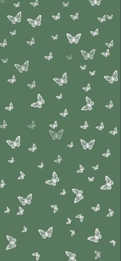 a green background with white butterflies on it