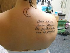 the back of a woman's shoulder with an inscription on it that reads, even almost there harms the golden days can be passed