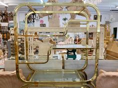 a gold and glass display case in a store