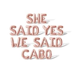 the words she said yes we said cabo are shown in pink foil on a white background