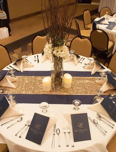 the table is set with silverware and place settings