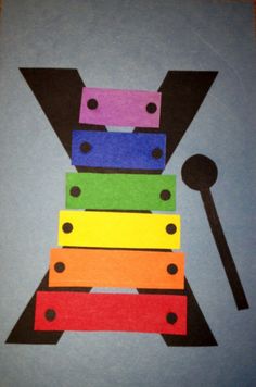 an image of a multicolored musical instrument made out of paper