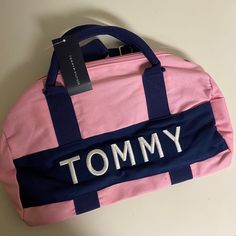 It’s New Not Used. Tommy Hilfiger Boys' And Girls' Bag. 14.5" (L) X 8" (W) X 8" (H). 100% Cotton. Trendy Satchel Duffle Bag For School, Everyday Pink Bags, Pink Tote Bag For Back To School, Trendy Pink Shoulder Bag With Logo, Back To School Pink Tote Bag, Trendy Pink Duffle Bag For On-the-go, Trendy Pink Duffle Bag With Zipper Closure, Casual Pink Duffle Bag With Adjustable Strap, Casual Tommy Hilfiger Bag With Adjustable Strap