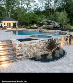 an outdoor swimming pool with steps leading up to it