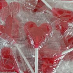 heart shaped lollipops are wrapped in plastic