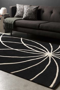 a black and white rug in a living room