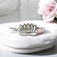 Elevate your style with our pretty 🌸 Lotus Flower Sterling Silver Ring - a symbol of purity, renewal, and spiritual growth. Crafted from high-quality 925 Sterling Silver, this beautiful lotus flower-shaped ring adds a touch of elegance to any outfit. 🌟 🎁 Arriving in a charming pink gift box with a matching pink cleaning cloth, it's not just a ring; it's a thoughtful present for yourself or a loved one. 💖 Choose from three sizes: 1️⃣ Small/Medium - UK: N - US: 7 2️⃣ Medium - UK: P - US: 8 3️⃣ Spiritual Sterling Silver Flower Ring, Spiritual Flower Shaped Rings As Gifts, Spiritual Sterling Silver Flower Ring As A Gift, Pink Cleaning, Pink Gift Box, Finding Inner Peace, Spiritual Growth, Lotus Flower, Inner Peace