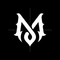 the letter m is made up of white letters and black background with an intricate design