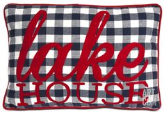 a pillow with the words lake house on it in red and white checkered fabric