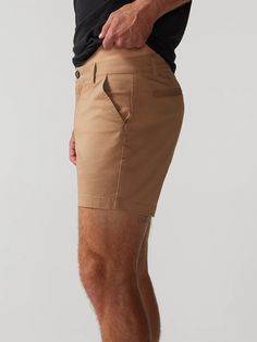 Built for those classy moments where you gotta dress your casual shorts up. Made with our classic Originals spandex stretch fabric in a classier, more tailed fit, the Flat Front shorts are designed to give you that elevated chino look without sacrificing comfort. They rock a non-elastic waistband and oxford lined pockets, so whether you're headed to the golf course or a casual lunch meeting, you can feel confident that all of your necessities are safe and secure. Fabric: 98% cotton / 2% spandex Fitted Shorts With Pockets And 5-inch Inseam, Slim Fit Bottoms For Business Casual Summer, Slim Fit Bottoms For Summer Business Casual, Summer Business Casual Slim Fit Bottoms, Classic Stretch Bottoms With Built-in Shorts, Classic Bermuda Shorts With Built-in Shorts, Fitted High-waisted Elastane Shorts, Fitted Knee-length Shorts For Business Casual, Slim Fit Summer Bottoms Short Length