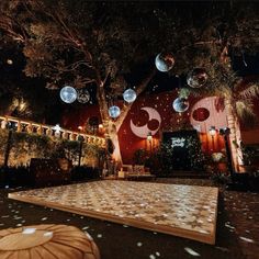 an outdoor dance with lights and decorations