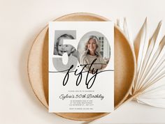 the 50th birthday card is on top of a plate