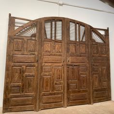 an old wooden door with intricate carvings on the doors and sides is shown in this photo