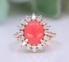 Ring details gemstone shape- oval gemstone type -  lab created pink gemstone gemstone size- 10x8 mm gemstone weight- 2.45 ct.                                gemstone setting - prong type moissanite accent plating type-14kt rose gold vermeil i also prepare custom orders as per customer desire. feel free to contact if you want any customize product. Pink Opal Gemstone Ring For Anniversary, Pink Halo Ring With Gemstone For Gift, Pink Opal Ring With Accent Stones As Gift, Pink Oval Cluster Ring Fine Jewelry, Pink Oval Halo Ring For Anniversary, Pink Oval Cluster Promise Ring, Pink Opal Ring For Anniversary, Fine Jewelry, Pink Opal Ring For Anniversary, Pink Opal Ring Fine Jewelry