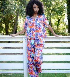 Our pajama sets are like wrapping yourself in a hug from your favorite auntie. With one-of-a-kind prints designed to represent, you'll slide into bed feeling like royalty. The top? Short-sleeved and just loose enough, because we know nobody's got time for feeling stuffy. And these pants – they've got that stretchy waistband, so go ahead and have that extra slice of pie, honey. Plus, pockets! Now, can we talk about this print? It’s a whole mood, showcasing the beauty and grace of Black women. Eve Slice Of Pie, Can We Talk, Fly Girl, A Hug, Tee Outfit, Pajama Top, Pajama Sets, Pj Sets, Tee Shop