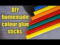 some colored sticks are stacked on top of each other with the words diy homemade color glue sticks