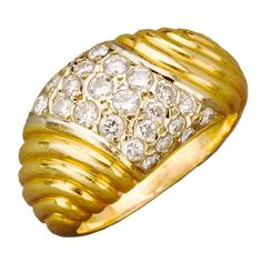 An elegant French 18k gold dome ring, of tapered ribbed design, the center pavé set with diamonds 28 bright white diamonds Paris, 20th century, hallmarked with maker's stamp. Size 4 3/4. Dome Rings, Gold Dome Ring, The Ring Face, Buckle Ring, Gold Cocktail Ring, Dome Ring, Gold Cocktail, Coral Jewelry, Domed Ring