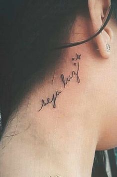 a woman with a tattoo on her neck that reads, i love you and the word's in cursive writing