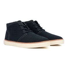 The Petrus boot features the iconic Chukka boot style featuring classed-up looks and sneaker-level comfort. Classic Navy High-top Sneakers, Classic Navy Sneakers With Round Toe, Sporty Navy Sneakers With Stitched Sole, Navy Canvas Sneakers With Rubber Sole, Navy Leather High-top Sneakers, Casual High-top Sneakers With Textured Sole For Winter, Casual Winter High-top Sneakers With Textured Sole, Casual Winter Ankle Boot Sneakers, Casual Mid-top Lace-up Boots With Rubber Sole