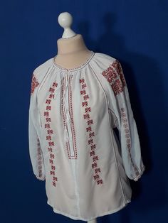 "This traditional romanian blouse is made from chiffon  fabric and decorated with silk thread digital embroidery.   I kept here the \"archaic\" cut, specific to the area of origin, is an Olt, and the pieces of material were united with a special seam, called \"keys\". The time required for making is 3-4 weeks. Please indicate following measures: Bust line- Waist line- Hips line- in inch or in cm. Are points 2, 4, 5 of measuring guide, what you can see in the pictures." White Tunic Blouse For Festival, Peasant Style Embroidered Tunic Top, Traditional Embroidered Tunic Peasant Top, White Peasant Tunic Top, Folk Style Peasant Top With Embroidered Sleeves For Festival, Traditional Peasant Top With Embroidered Sleeves For Festivals, Traditional White Blouse With Geometric Embroidery, White Peasant Blouse With Embroidered Border, Folk Style Embroidered Tunic Top