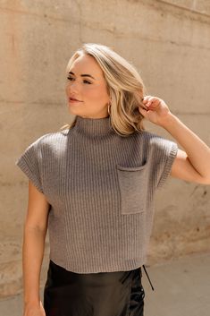 Front view of female model wearing the Waverly Mock Neck Sweater in Grey. Fall Mock Neck Top With Ribbed Neckline For Work, Trendy Ribbed Sweater Vest For Fall, Gray Ribbed Sweater For Workwear, Ribbed Knit Top For Workwear, Chic Spring Knit Mock Neck Top, Chic Knit Mock Neck Top For Fall, Ribbed Turtleneck Knit Top For Work, Turtleneck Sweater Vest For Work In Fall, High Neck Knit Top For Fall Workwear