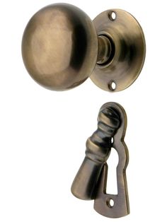 an old style door handle with a ball on the top and a lever attached to it