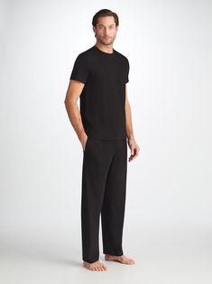 The ideal loungewear companion, the black trouser fastens with an elastic and tie waistband for a winning combination of comfort and flattering fit. The two front side pockets and a rear back pocket help to keep your phone and essentials close while you're lounging, while the black colour makes them easy to pair with our matching lounge t-shirts and hoodies. Our Basel fabric has to be touched to be believed. It offers long-lasting softness and doesn't pill, making it able to withstand countless Black Sweatpants With Side Pockets And Straight Hem, Black Sweatpants With Side Pockets, Black Straight Pants For Loungewear, Black Sweatpants With Straight Hem For Work, Black Pants With Straight Hem For Loungewear, Black Loungewear Pants With Straight Hem, Black Straight Leg Sweatpants For Lounging, Black Lounging Pants Full Length, Black Loungewear Pants