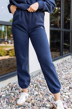 PRODUCT DESCRIPTION Get your cool, casual look on-point in the Smiley Sweatpants. Featuring a high elasticated waistband, elasticated ankles, side pockets, soft fleece fabric for extra comfort and embroidered smiley logo on front of the left leg. You can complete the tracksuit with the matching Smiley Hoodie for the perfect off-duty look. DETAILS & FIT Relaxed loose fit Elastic waist Elastic ankles Slant pockets Rise: 12.5" (based on a size small) Inseam: 30" (based on a size small) FABRIC & CARE 50% cotton 50% polyester Hand wash Basic Jogging Bottoms With Elastic Waistband, Fall Basic Joggers With Elastic Waistband, Trendy Sweats With Elastic Waistband For Jogging, Basic Jogging Pants With Elastic Waistband, Basic Jogging Pants With Comfort Waistband, Sporty Pull-on Sweatpants For Fall, Sporty Bottoms With Elastic Waistband For Winter, Trendy Relaxed Fit Jogging Bottoms, Sporty Cotton Pull-on Joggers