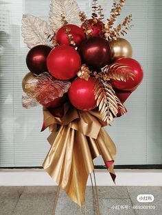 a bouquet of red and gold christmas ornaments