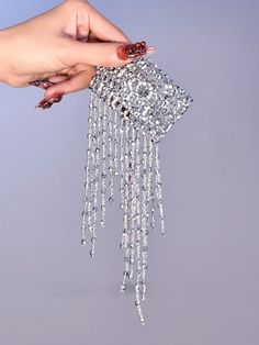 Enhance your cyberpunk look with our stunning cyberpunk silver gothic tassels beads stretch bracelet. This edgy and versatile bracelet features intricate tassels and beads, adding a touch of gothic flair to any outfit. Whether you're attending a music festival or a night out with friends, this stretch bracelet is the perfect accessory to make a bold fashion statement.  Please note that this product includes only one bracelet.  Garment Size   	 		 			Size 			Free Size 		 		 			Adjustable Circumfe Trendy Silver Fringe Jewelry, Silver Jewelry With Beaded Fringe For Festivals, Silver Party Jewelry With Beaded Fringe, Silver Beaded Bracelets With Chain For Party, Silver Beaded Bracelet With Chain For Party, Party Beaded Chain Bracelets, Cyberpunk Look, Steampunk Heart, Mesh Gloves