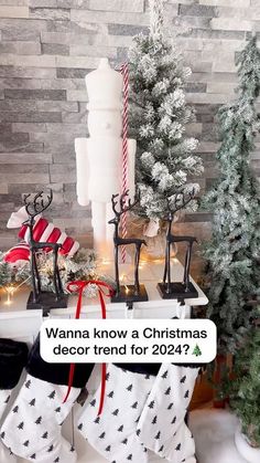 a christmas stocking display with stockings and candles