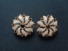 "Stunning Vintage Swarovski Swan Sparkling Ice Crystal With Square Princess and Round Black Onyx Glass Yellow Gold Plated Fancy Floral Designs Clip on Back Earrings Measure approximately 1-1/2 inches across. They are in excellent vintage condition with very minor signs of wear if any. These stunning beautiful earrings are clean and ready to wear! Each earring is signed/marked with SWAN logos. For more brand names of vintage jewelry and accessories please see our \"High End Vintage Jewelry\" Shop Black Earrings With Diamond Accents, Black Diamond Earrings For Wedding, Black Earrings With Diamond Accents For Wedding, Black Diamond Accent Earrings For Wedding, Black Wedding Earrings With Diamond Accents, Black Round Earrings For Wedding, Black Round Wedding Earrings, Black Diamond Accent Earrings For Anniversary, Black Diamond Earrings For Party