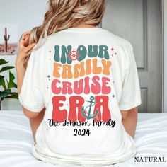 a woman sitting on top of a bed wearing a t - shirt that says, in our family cruise era