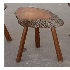 a wooden stool made out of tree trunks