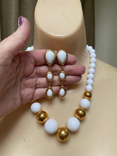 "You must have at least one set of white jewelry just for summer. White pearls don't count. I'm talking fun stuff. Necklace is signed Napier and earrings signed Trifari. Necklace will extend from 16 to 18\" with a hook clasp. Largest front beads are about 18 and 20mm round. They continue to be fairly big at about 10mm near clasp. Earrings are clip backs marked Trifari. Big look at 3\" but the largest section is against the earlobe. Not heavy anyway but I think the largest bead at top is a good i Formal White Jewelry Sets With Matching Earrings, White Dangle Costume Jewelry, Formal White Drop Jewelry, White Drop Jewelry For Formal Occasions, White Costume Jewelry For Jewelry Making, White Teardrop Jewelry For Party, Classic White Jewelry For Party, Classic White Necklace With Matching Earrings, Modern White Jewelry With Pearl Drop