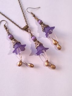 Purple Turquoise flower jewelry set purple flower set necklace earrings purple Turquoise flower bronze jewelry set purple Boho set gift for her Gorgeous  Victorian style jewelry set necklace and earrings . Bohemian necklace and earrings . Beautiful Set of bronze-tone filigree ornaments and rare purple Turquoise and purple plastic flowers necklace and earrings. Bronze Victorian style necklace and earrings. Boho necklace. Bohemian necklace and earrings. Romantic necklace and earrings. Royal style Nickel-free Flower-shaped Jewelry For Jewelry Making, Bronze Flower-shaped Jewelry Gift, Adjustable Bronze Jewelry For Gifts, Dangle Flower Charm For Jewelry Making, Bohemian Metal Jewelry With Flower Charm, Lavender Metal Jewelry As A Gift, Lavender Metal Jewelry As Gift, Lavender Metal Jewelry For Gift, Handmade Adjustable Lavender Jewelry