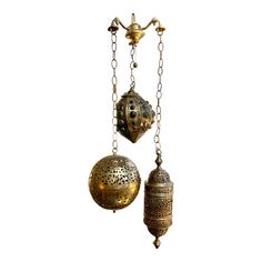 two hanging ornaments with chains attached to them